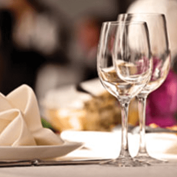 Two empty wine glasses on a table 